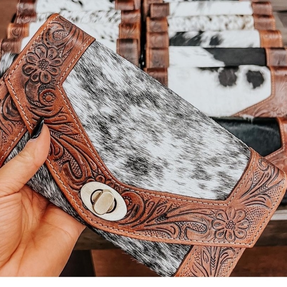 Cowhide wallet..opens up into 2 compartments with plenty of card holders